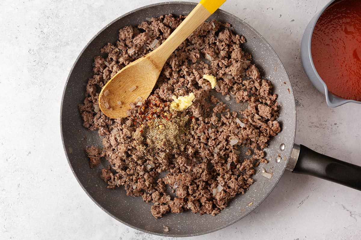 Beef being cooked in a saucepan