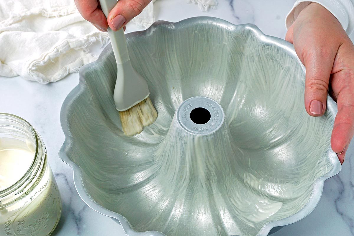 Brushing grease onto a bundt tin