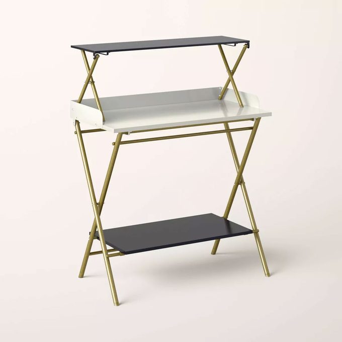 Kate Spade folding bar table on a tan background