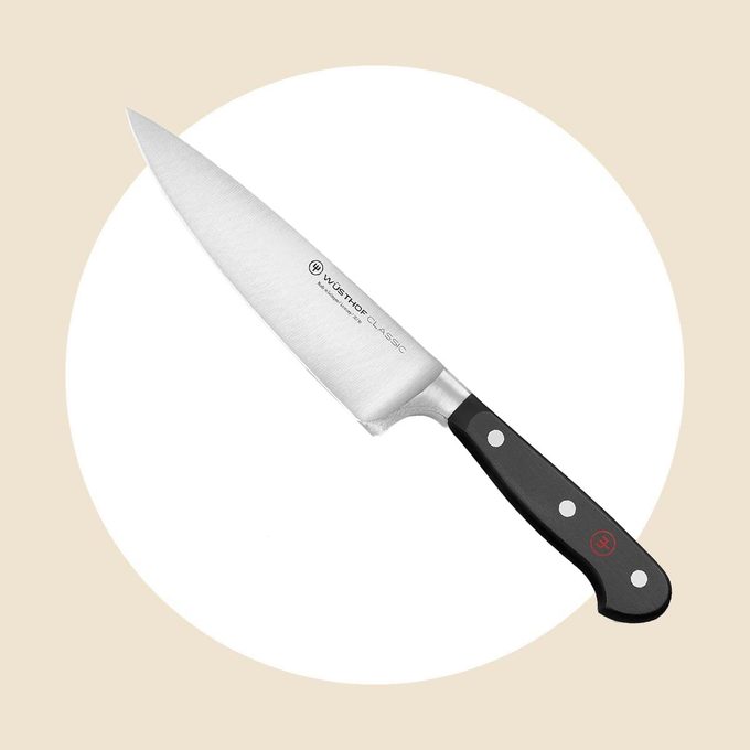 Wusthof Classic Chefs Knife 6 inch on a white and tan background