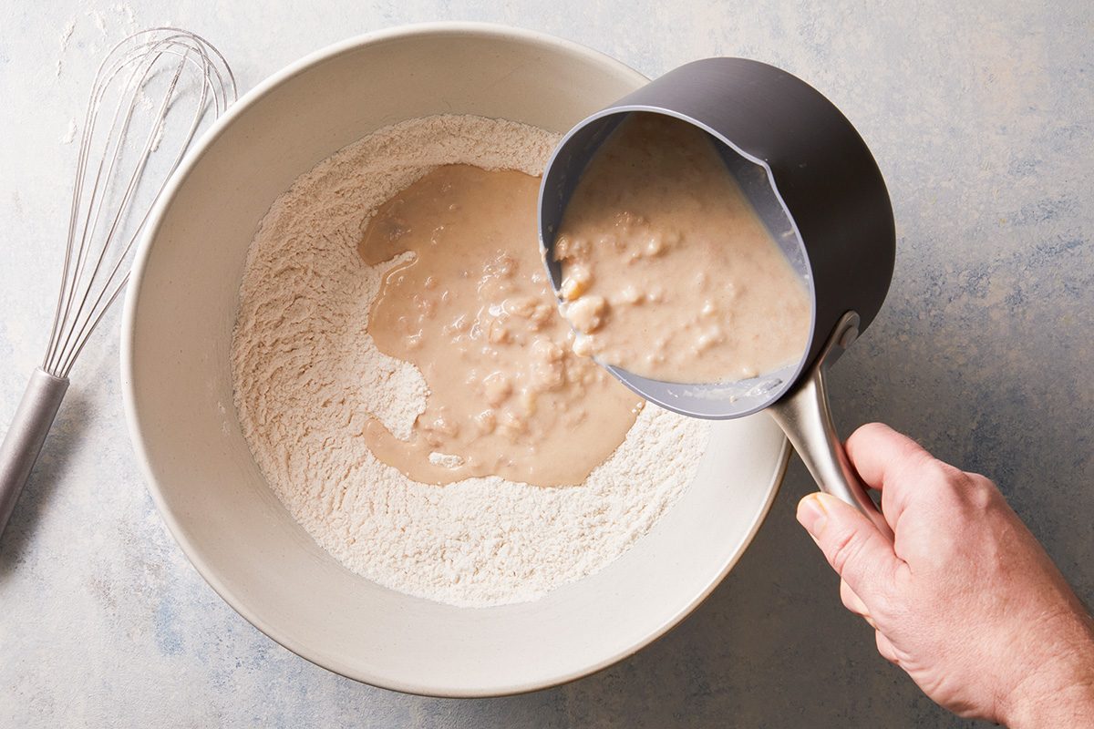 In a large bowl, mix sugar, yeast, salt and 2 cups flour.