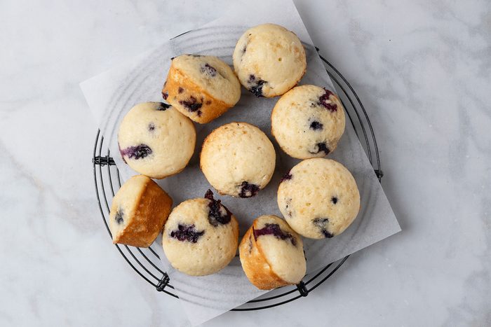 baked muffins being cooled on a wire rack