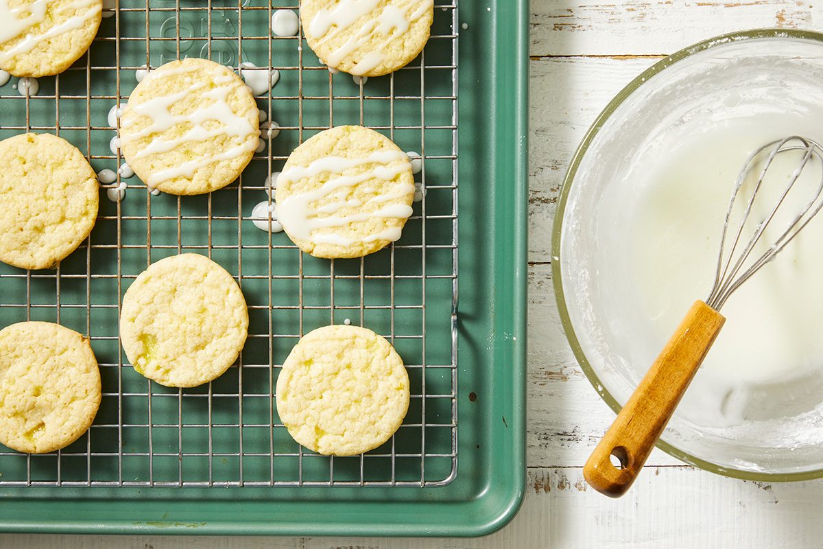 In a small bowl, whisk together confectioners' sugar and lemon juice, drizzle over cooled cookies.