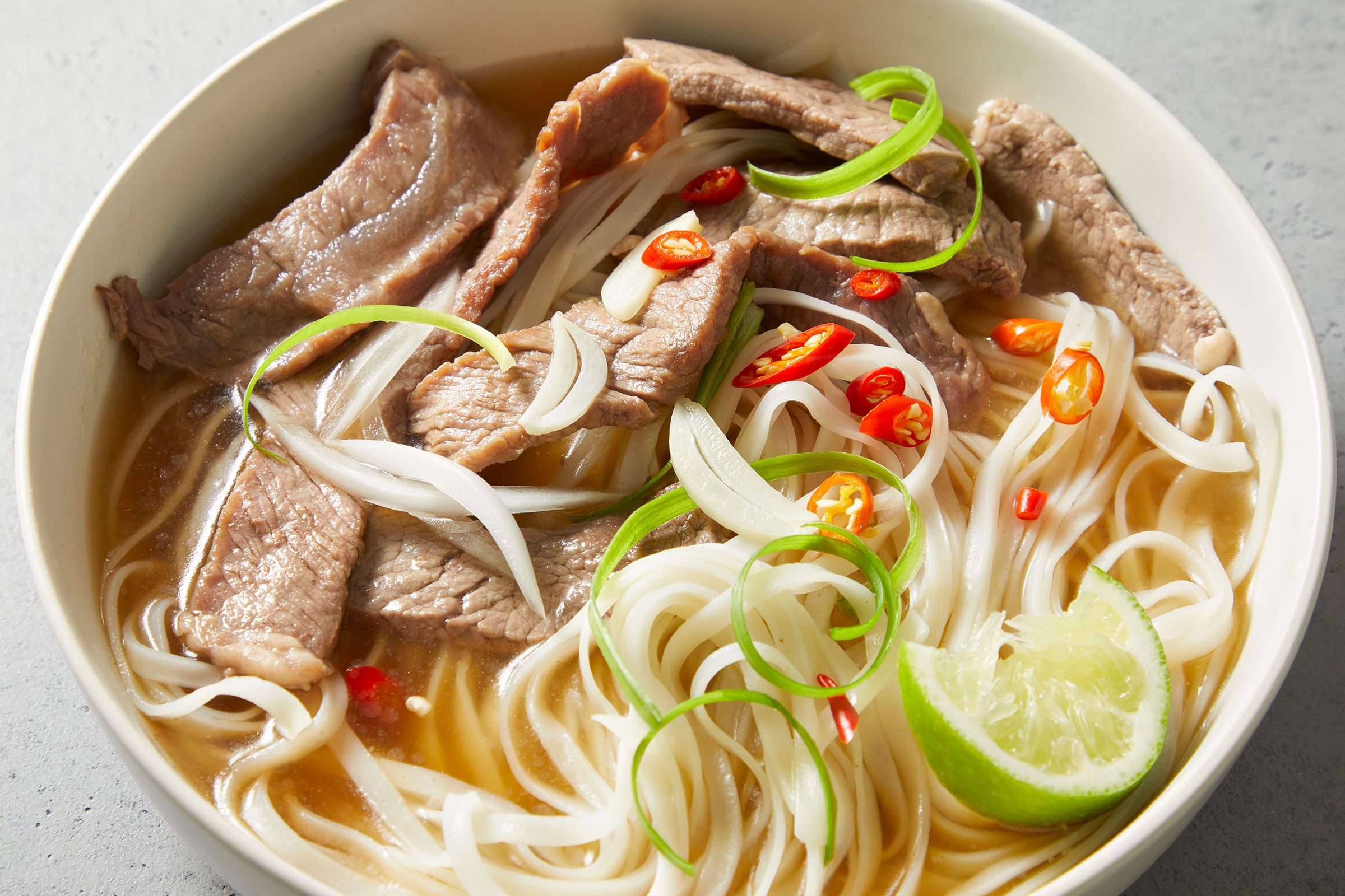 Pho (vietnamese Noodle Soup) in a big white bowl
