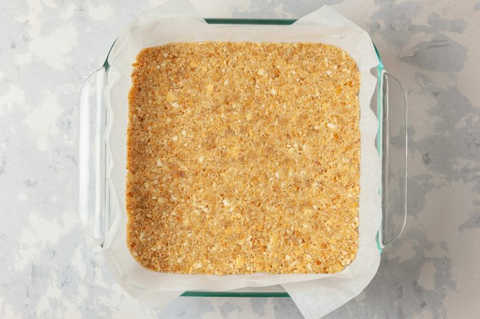 crushed vanilla wafer crumbs with the melted butter pressed on a baking tray