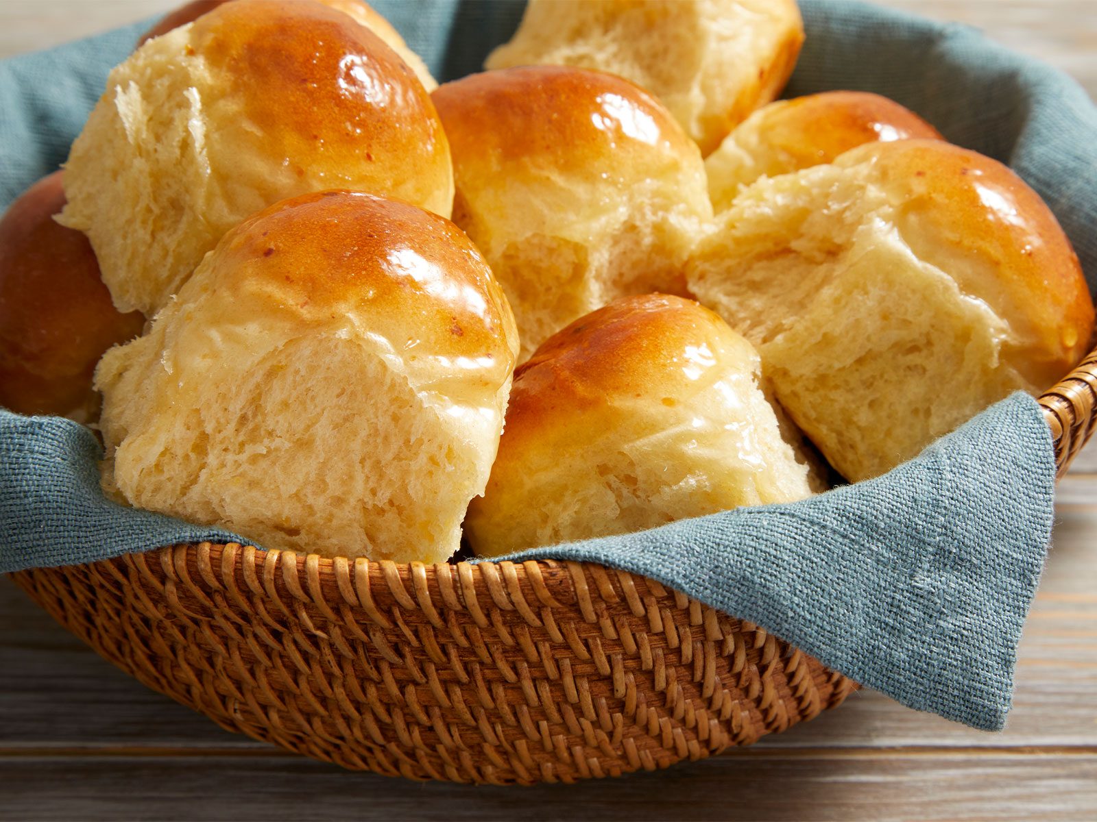 Dinner Rolls In a basket with blue cloth