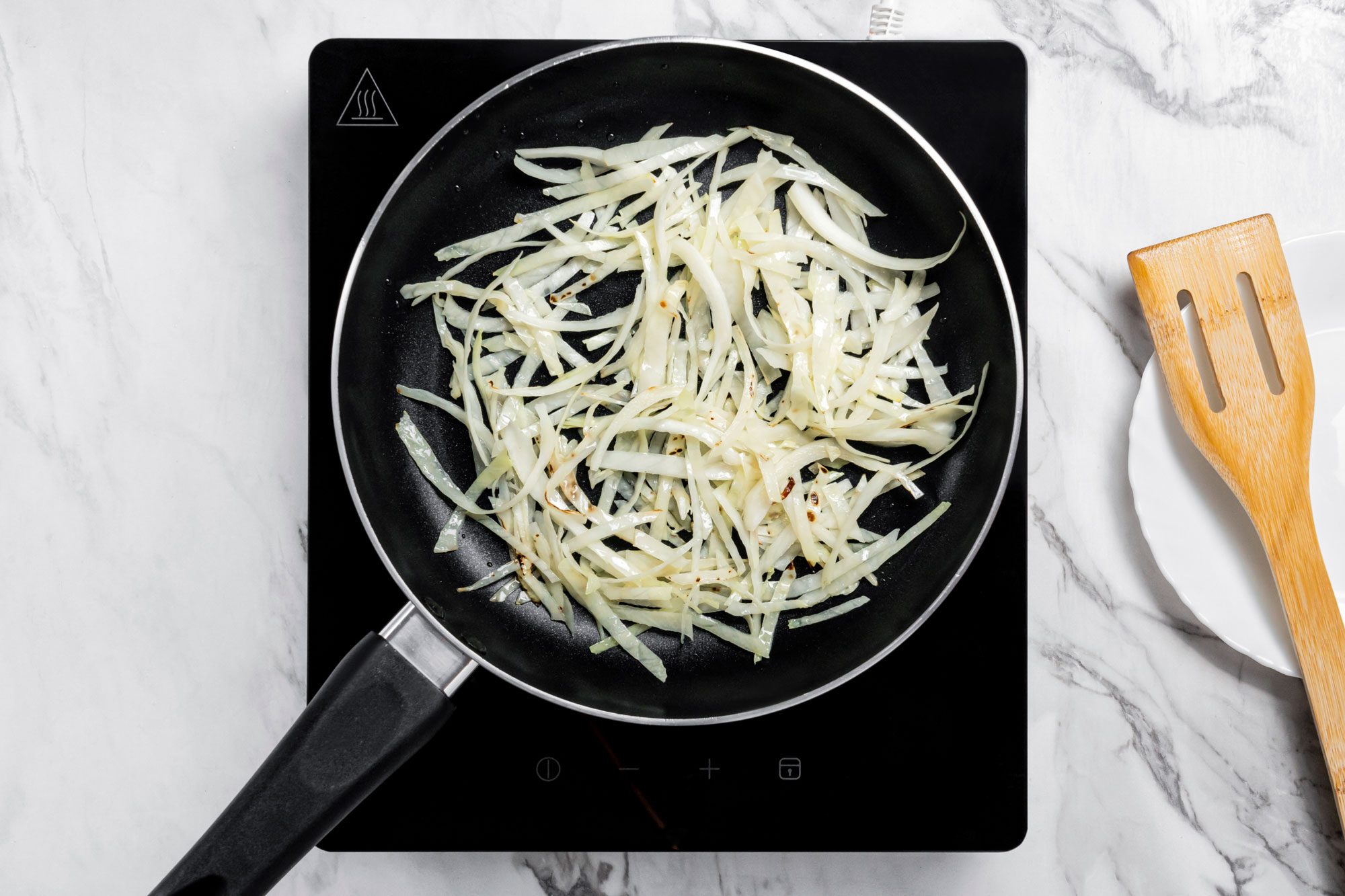 In a small skillet, stir-fry the cabbage