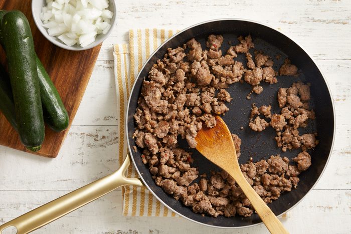 In a large skillet, cook sausage until no longer pink,