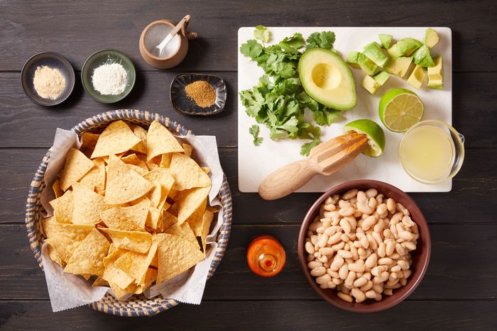 Cannellini beans Avocado Fresh cilantro leaves Lime juice Onion powder Garlic powder Chipotle hot pepper sauce Salt Ground cumin Baked tortilla chips