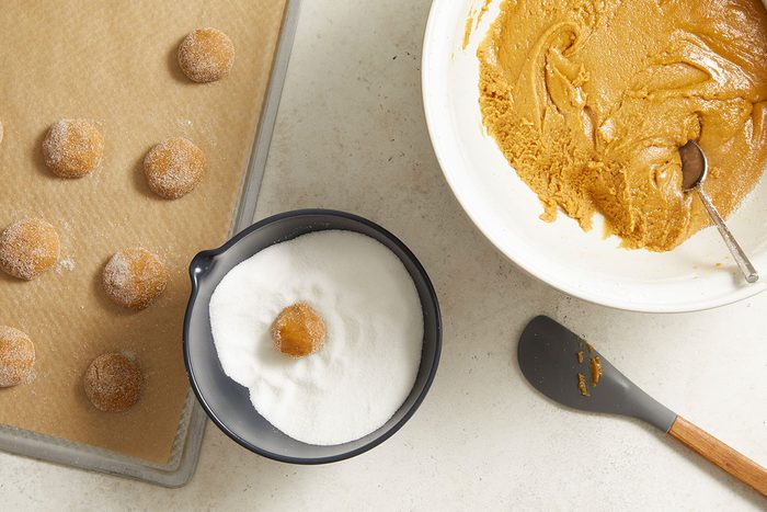 coating cookie dough balls with sugar