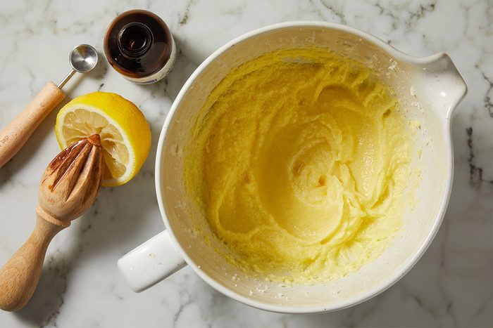 Beat in lemon juice and almond extract. to make Yellow Squash Cake