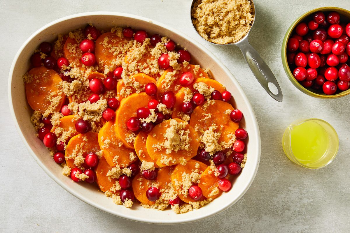 sliced potatoes in a greased 2-1/2-quart baking dish topped with half the cranberries, brown sugar and melted butter