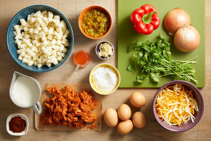 chorizo, frozen hash brown potatoes, onion, sweet red pepper, garlic cloves, eggs, half and half cream, chili powder, shredded cheese, cilantro and chopped green chiles