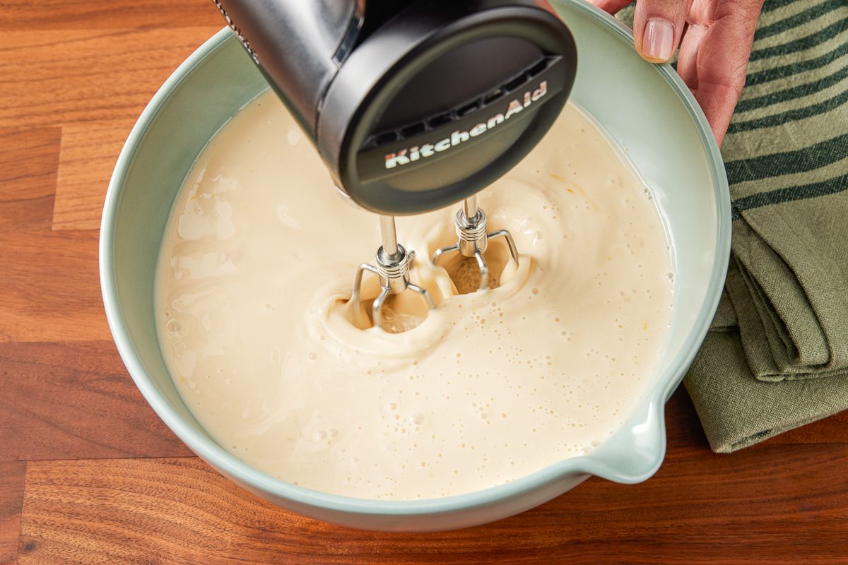 beating eggs, milk, 3/4 cup of sugar and vanilla in a bowl