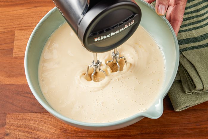 beating eggs, milk, 3/4 cup of sugar and vanilla in a bowl