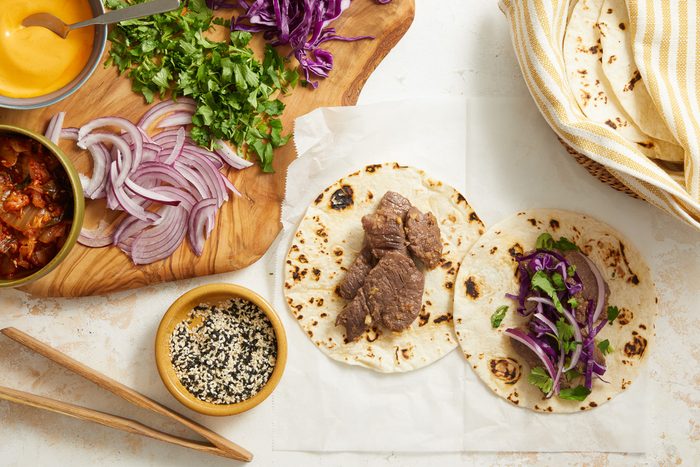 top view of tacos being assembled