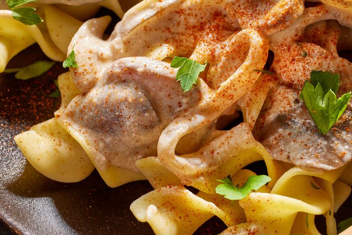 Mushroom Stroganoff close up shot with some garnishing on top of it.