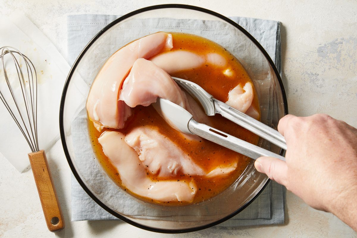 chicken, pickle juice, 1 tablespoon hot sauce, salt and pepper combined in a shallow bowl