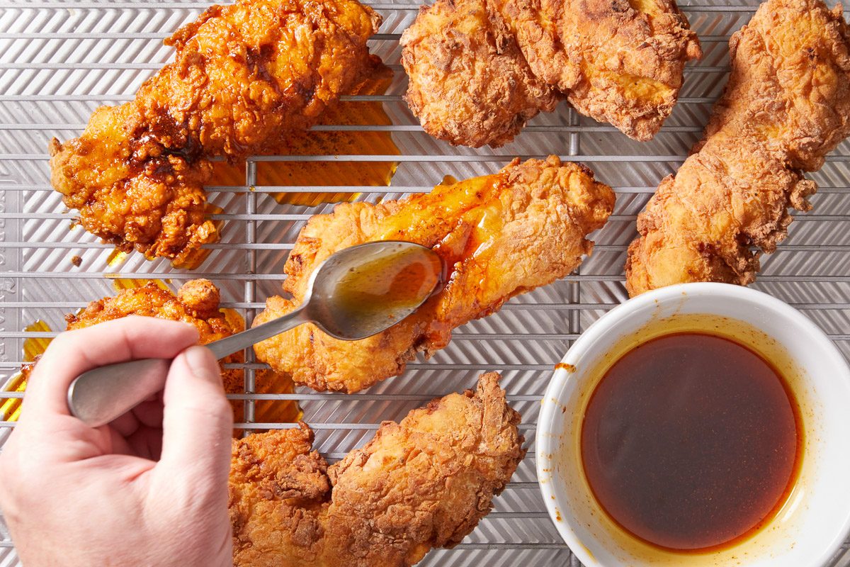 glazing chicken with olive oil, cayenne, brown sugar, chili powder, garlic powder, and paprika mixture