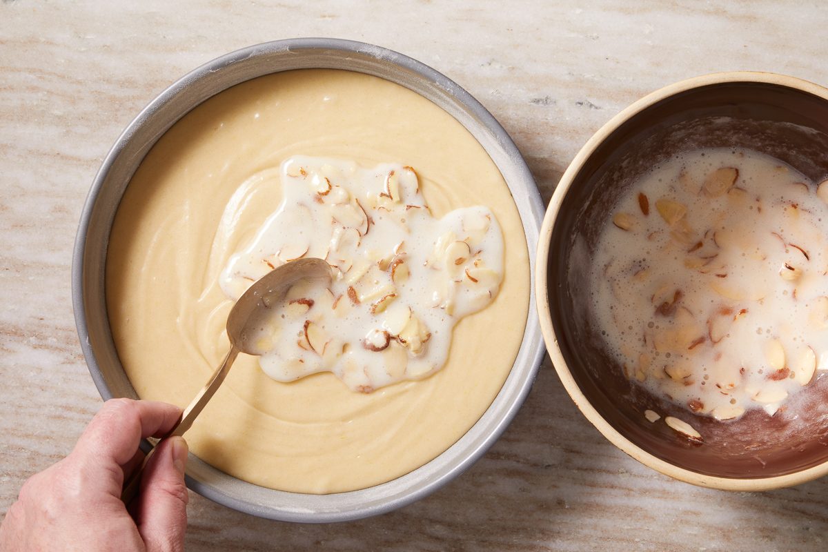 almond mixture being sprinkled on top of batter
