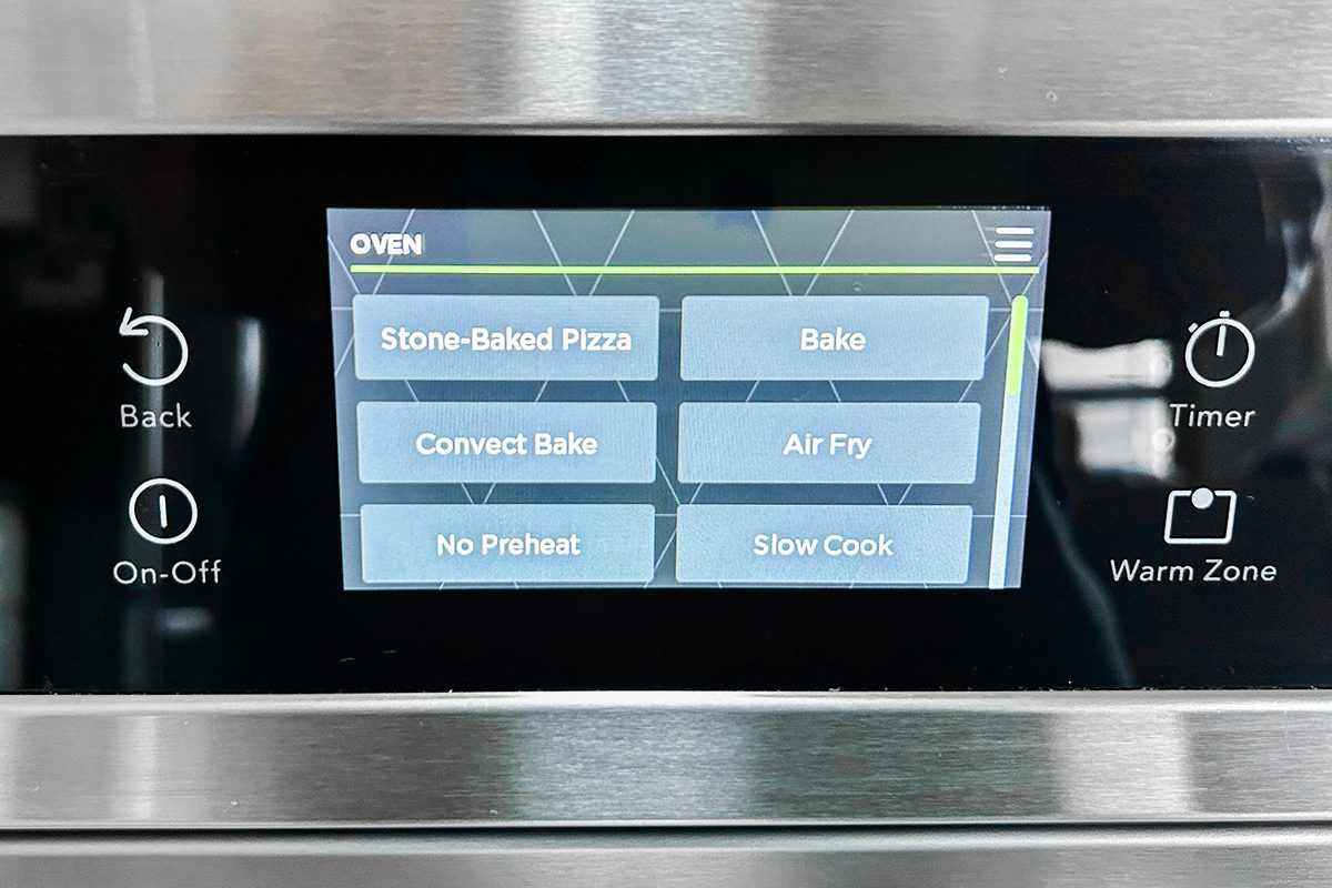 A close-up of a digital oven control panel displaying cooking options: Stone-Baked Pizza, Bake, Convect Bake, Air Fry, No Preheat, and Slow Cook. Surrounding buttons include Back, On-Off, Timer, and Warm Zone.